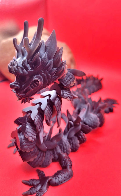 Resin 3D articulate dragon fidget toy.