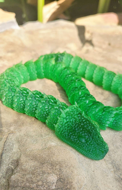 3D printed Basilisk articulated fidget toy.