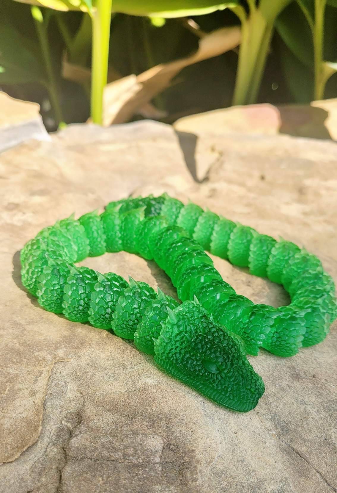 3D printed Basilisk articulated fidget toy.