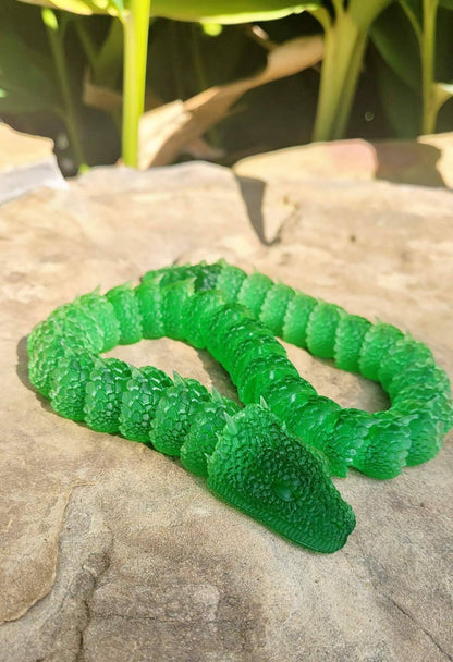 3D printed Basilisk articulated fidget toy.