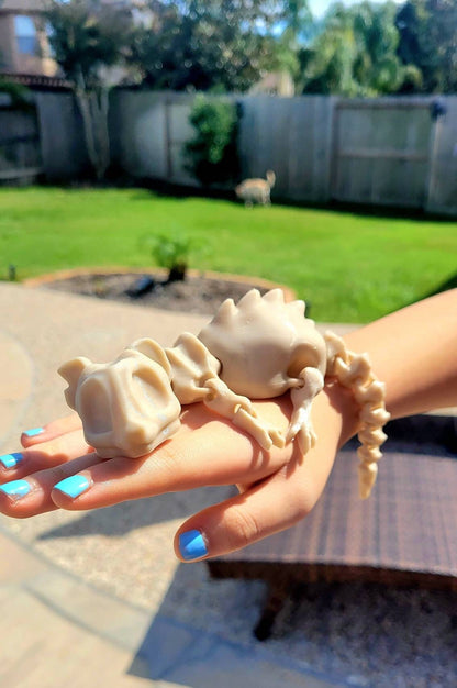 3D printed bone rat, articulated fidget toy.