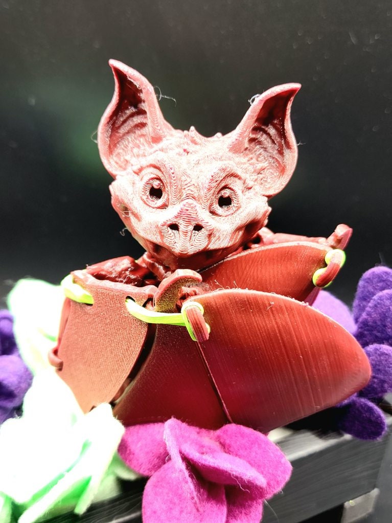 3D printed articulate bat fidget sensory toy.