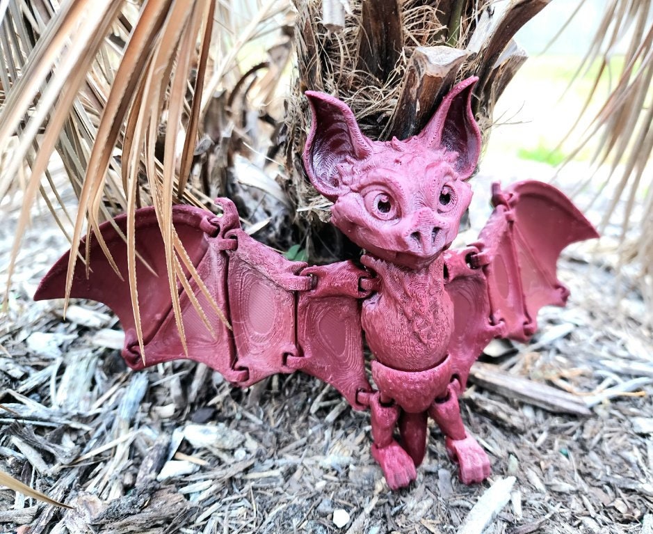 3D printed articulate bat fidget sensory toy.