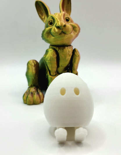 3D printed Easter eggs with collapsible legs. Able to stand and sit.