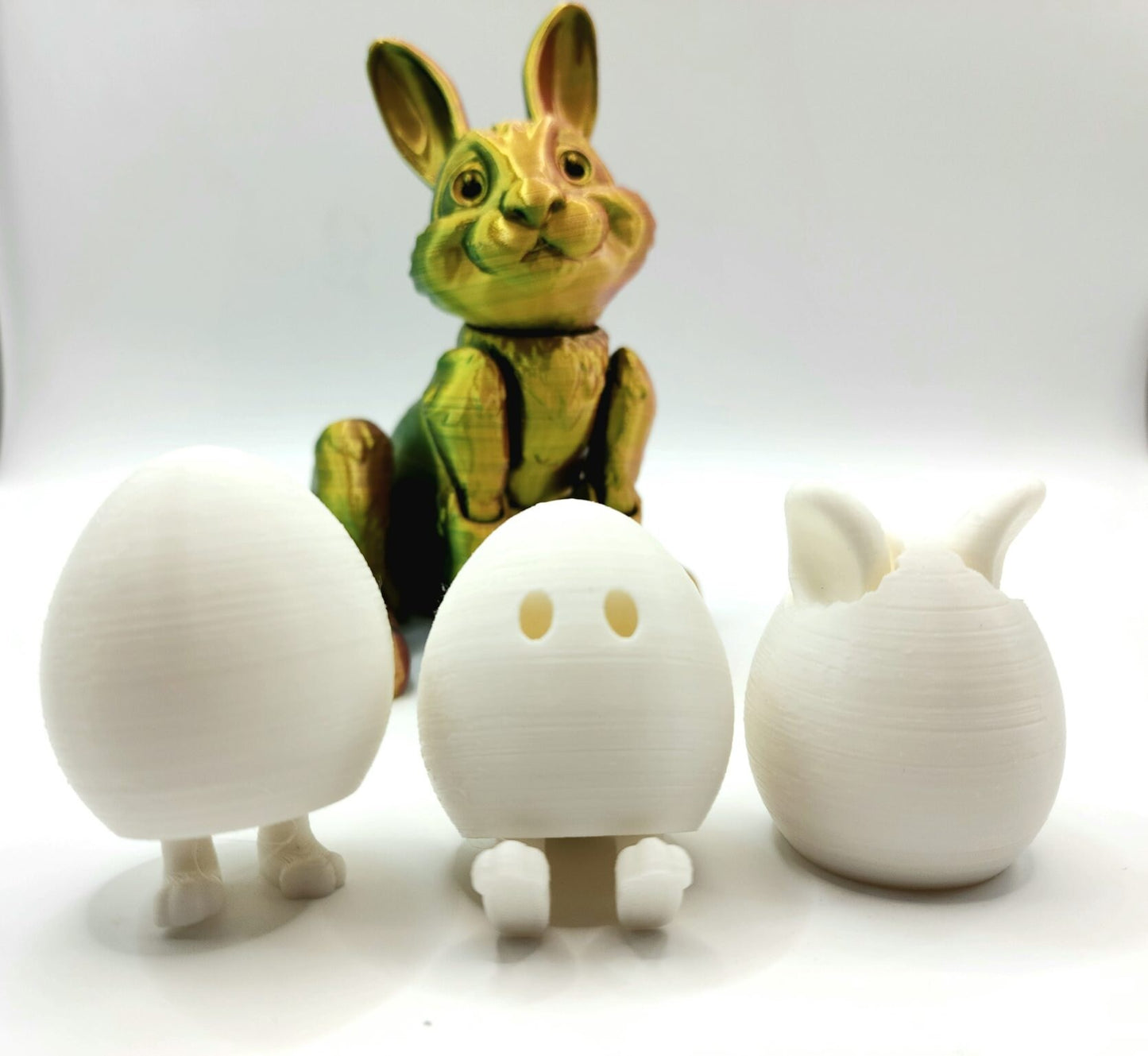 3D printed Easter eggs with collapsible legs. Able to stand and sit.