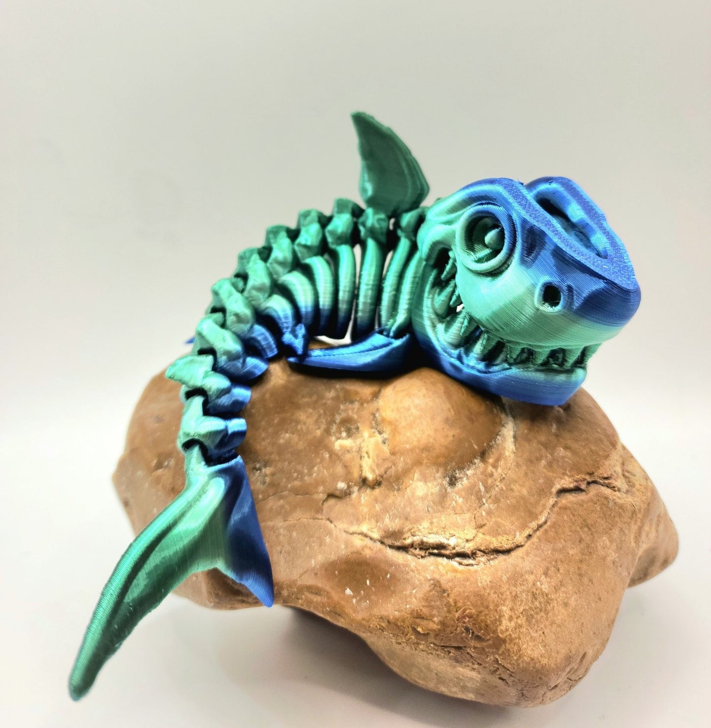 3D printed articulated skeleton shark with movable mouth. Fidget sensory toy, desktop toy.