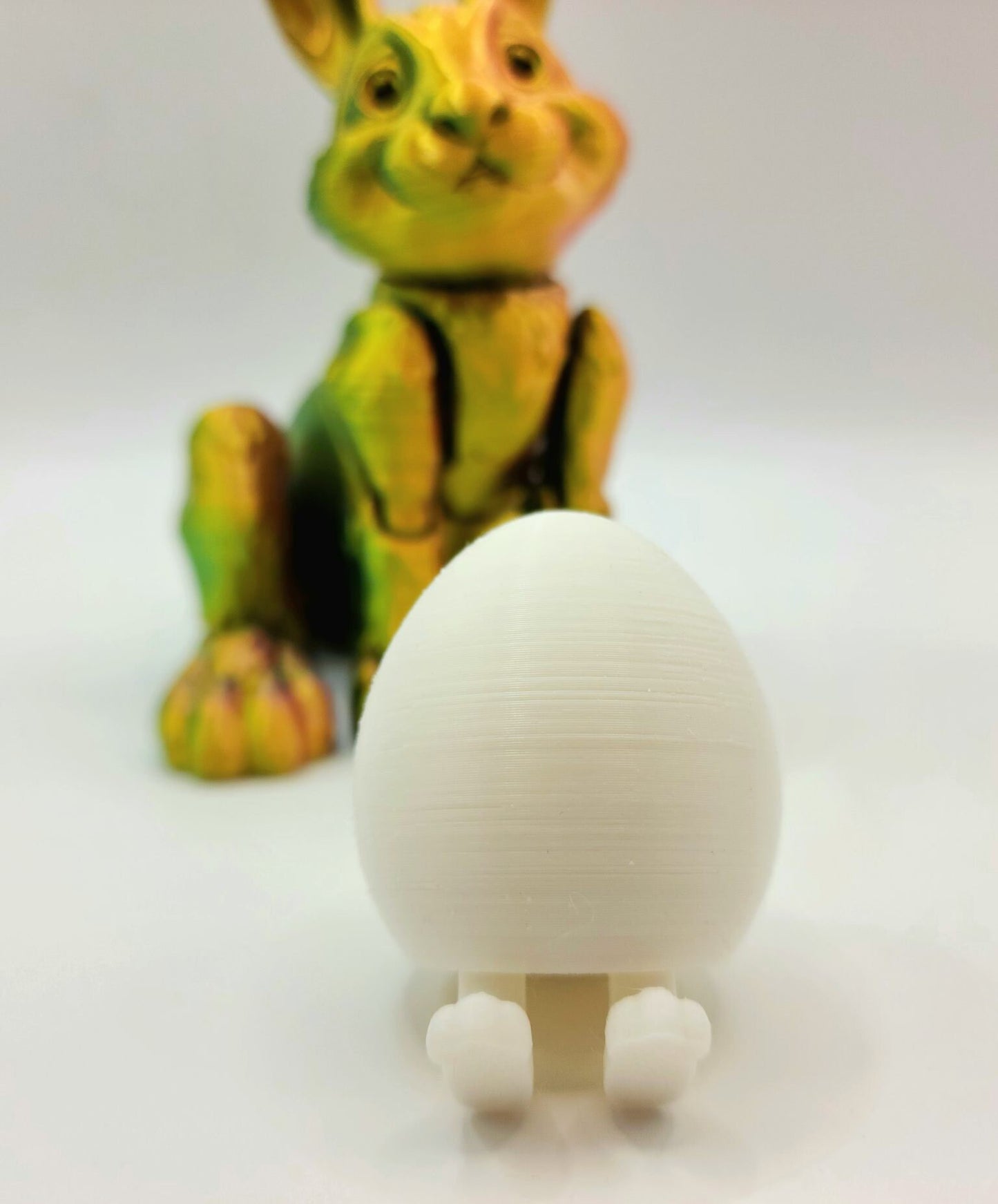 3D printed Easter eggs with collapsible legs. Able to stand and sit.