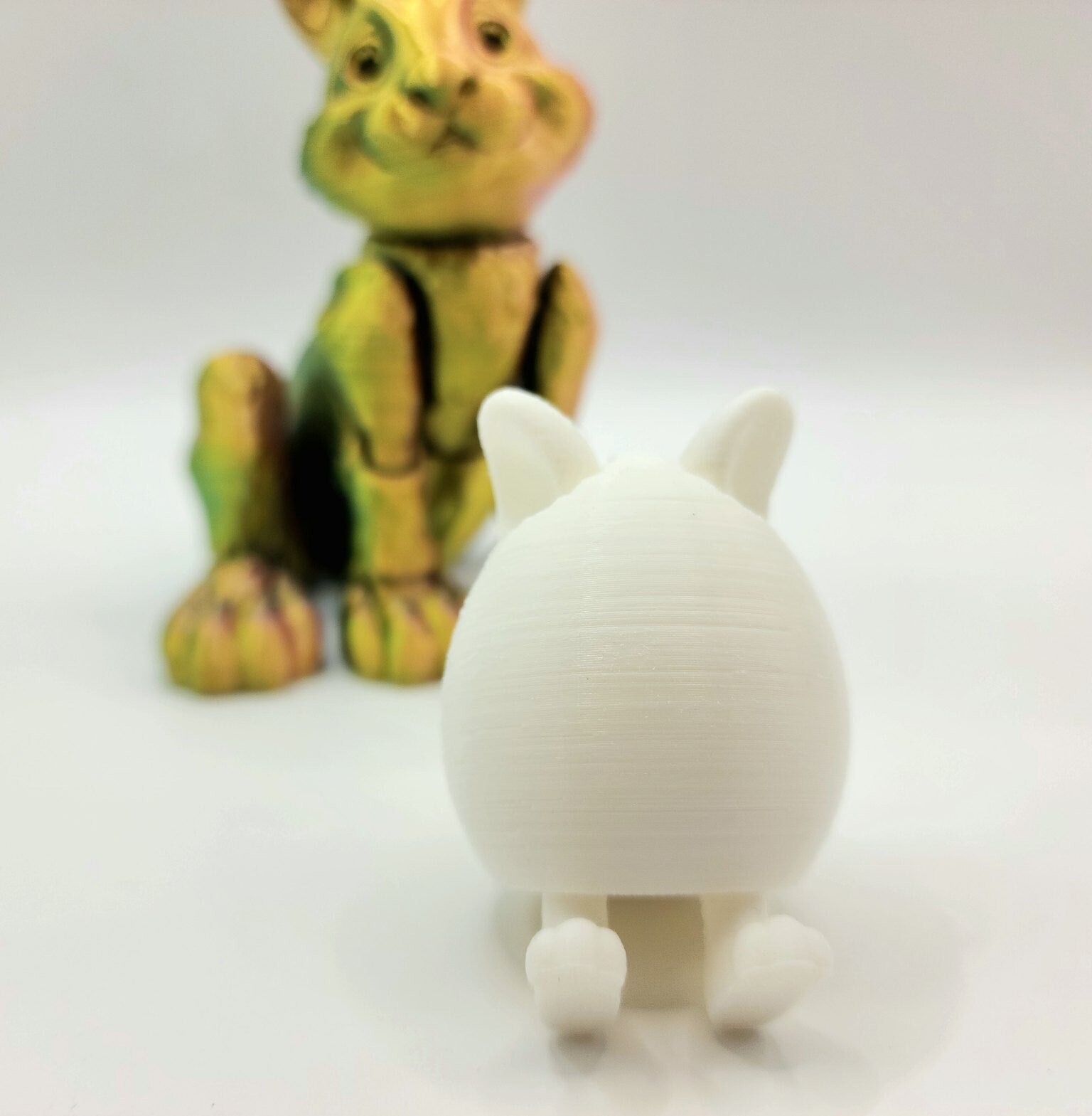 3D printed Easter eggs with collapsible legs. Able to stand and sit.