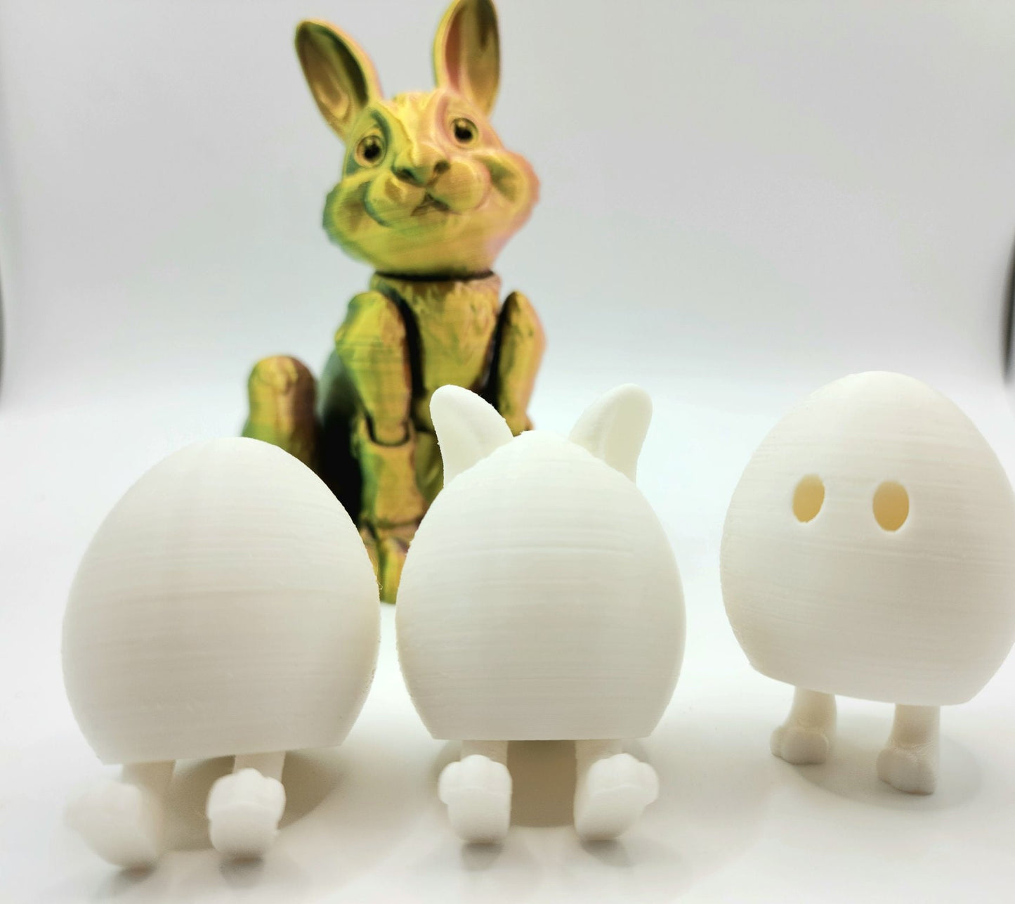 3D printed Easter eggs with collapsible legs. Able to stand and sit.