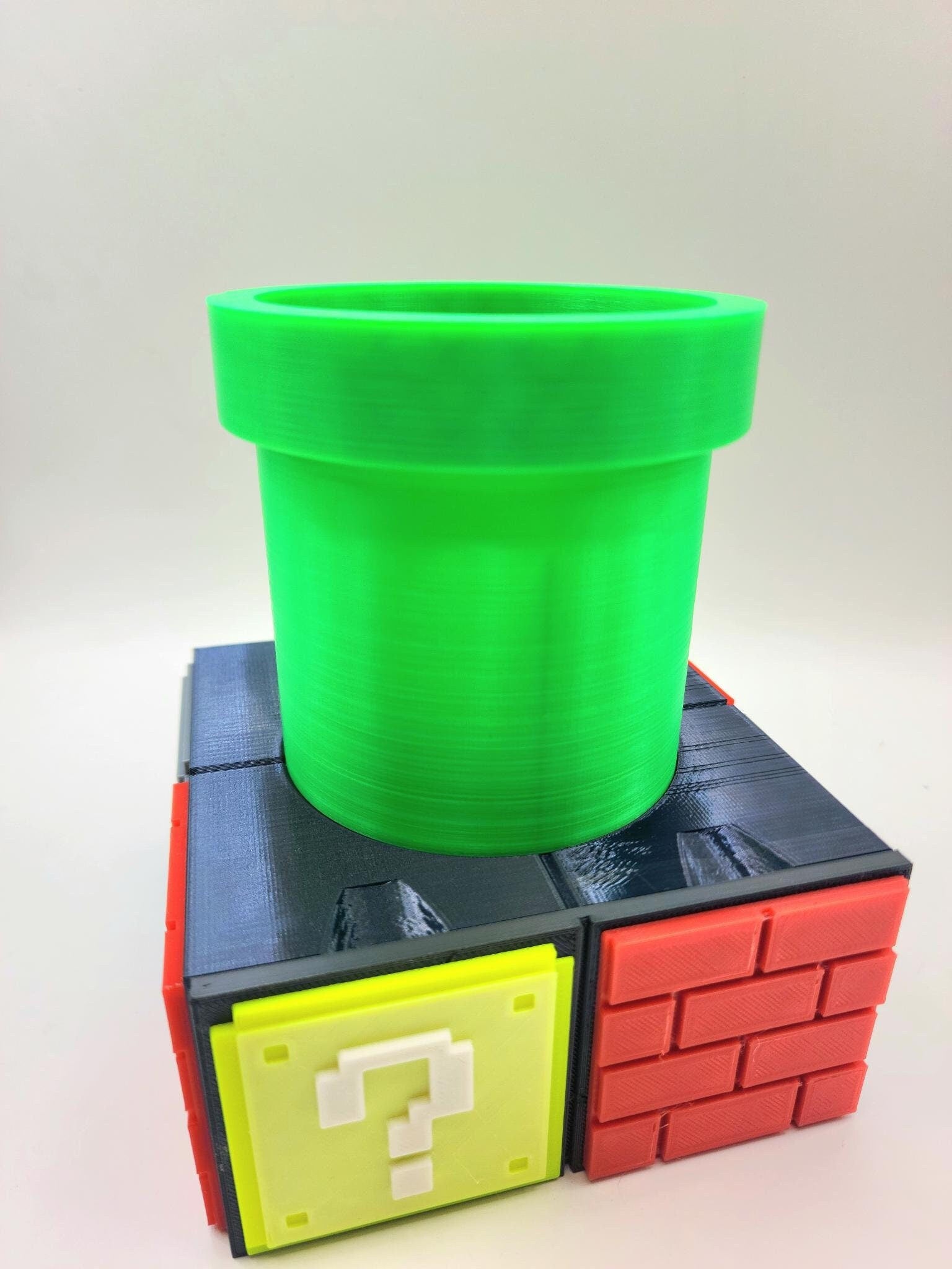 3D printed Super Mario inspired memory card organizer, drawer, pencil holder.