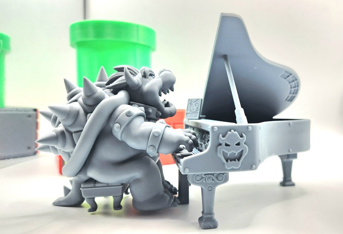 3D 14k resin printed Bowser playing piano featuring peach. DESKTOP Decoration, toy.