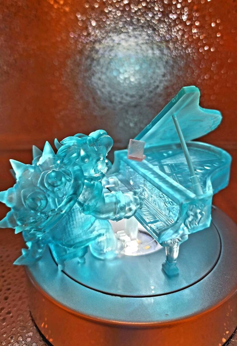 Resin printed Bowser playing Piano from Super Mario Brothers movie. Fan art, now include Princess Peach.