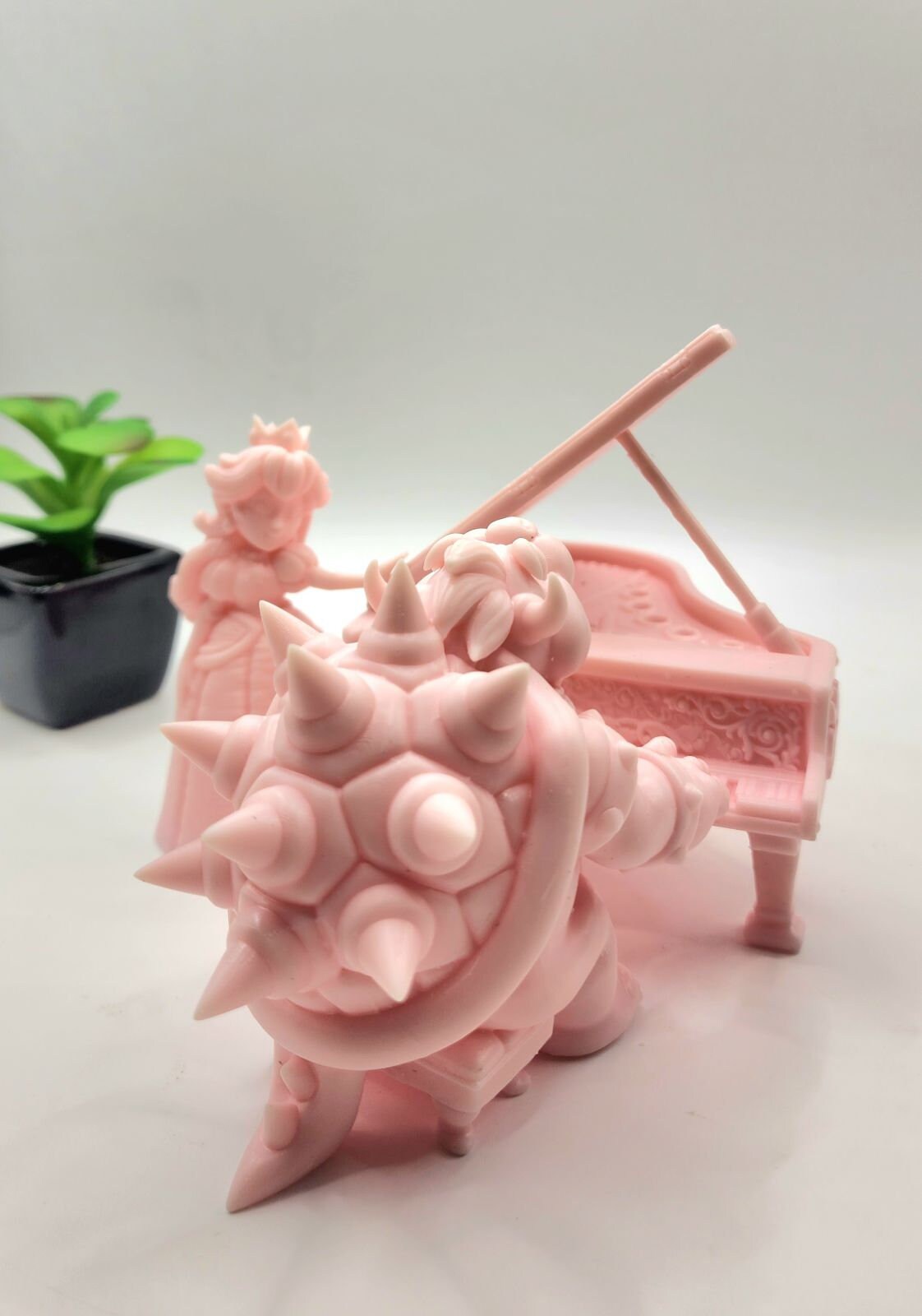 Resin printed Bowser playing Piano from Super Mario Brothers movie. Fan art, now include Princess Peach.