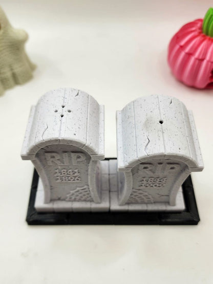 3D printed tombstone salt and pepper shakers.