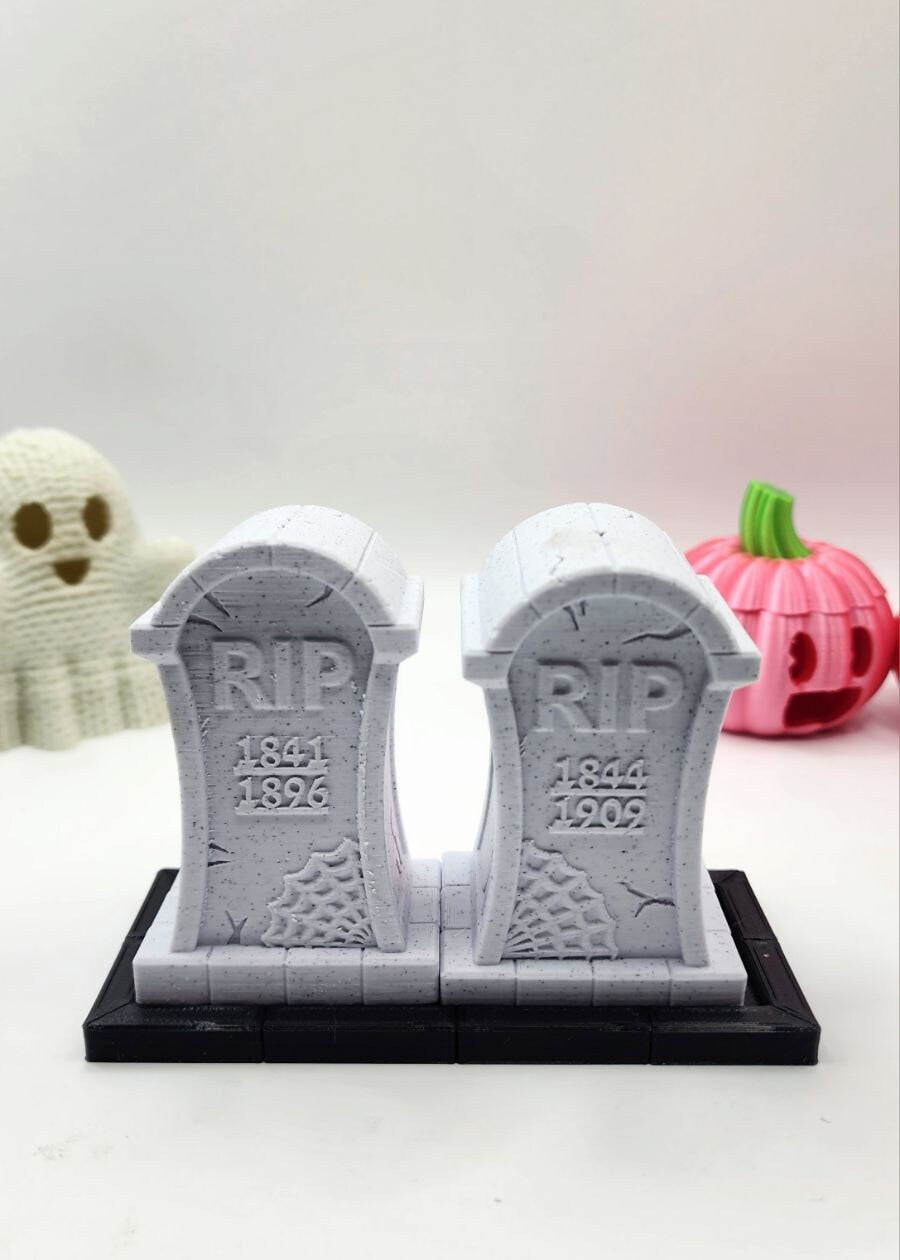 3D printed tombstone salt and pepper shakers.