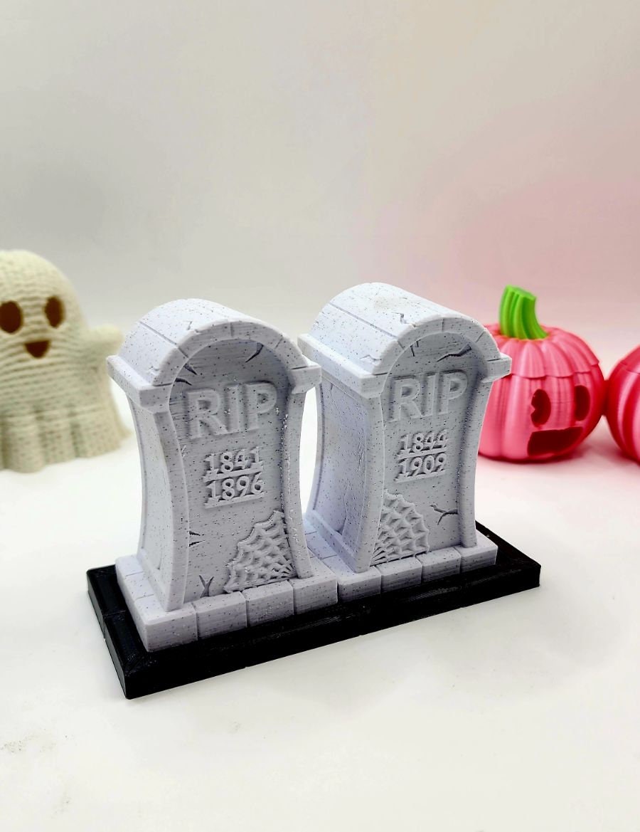 3D printed tombstone salt and pepper shakers.