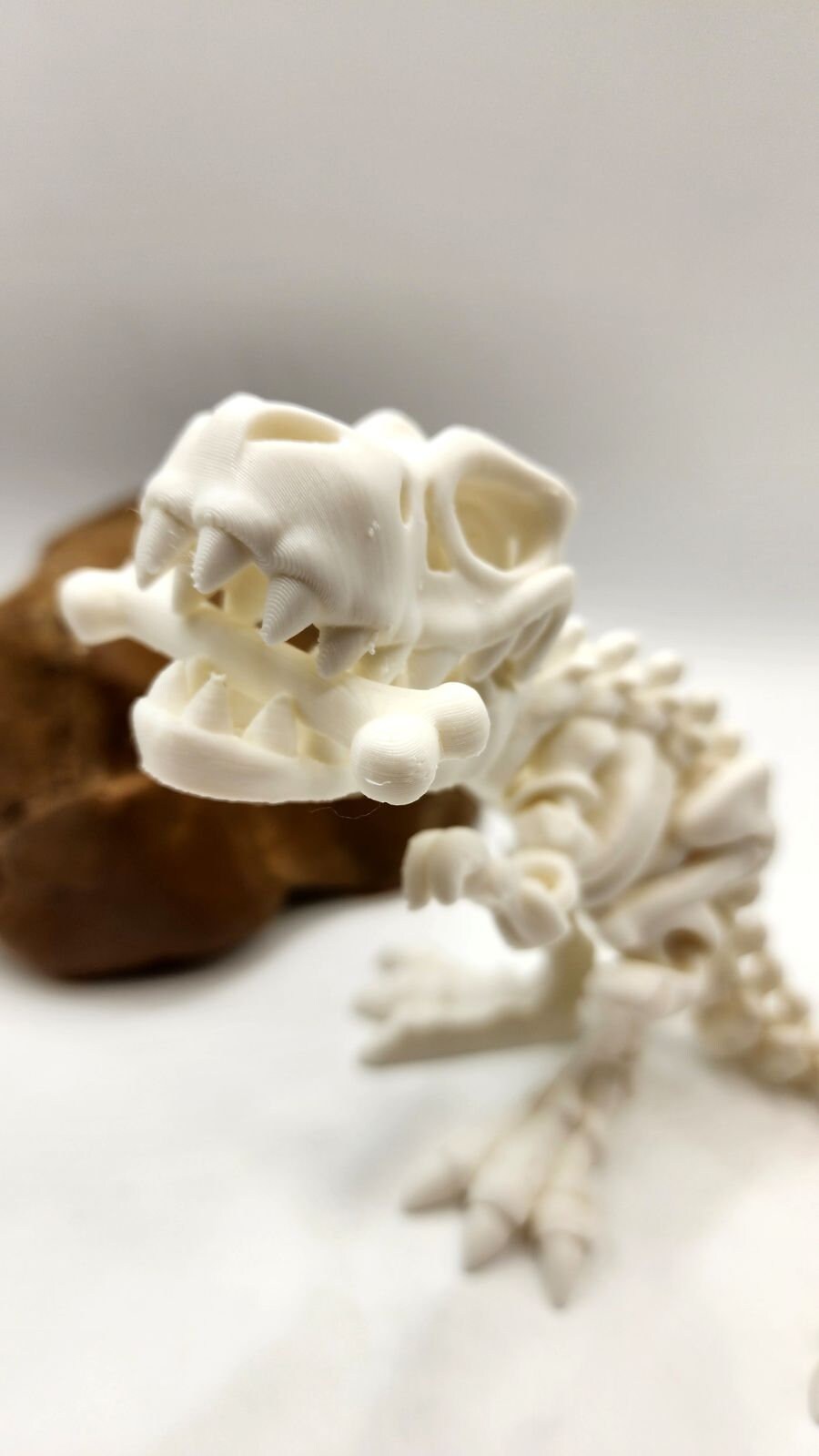 3D printed articulate skeletal T Rex fidget, sensory toy.