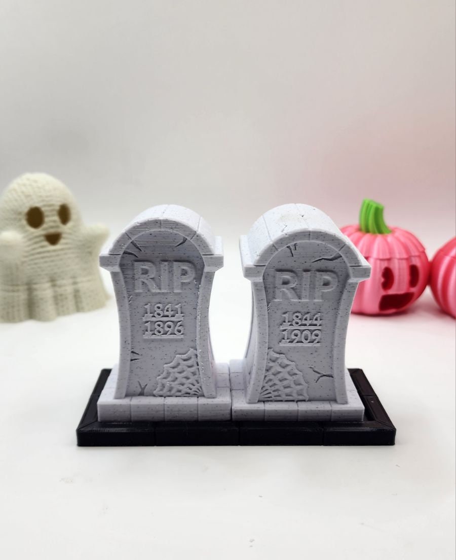 3D printed tombstone salt and pepper shakers.