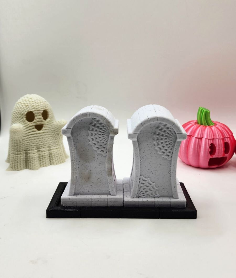 3D printed tombstone salt and pepper shakers.