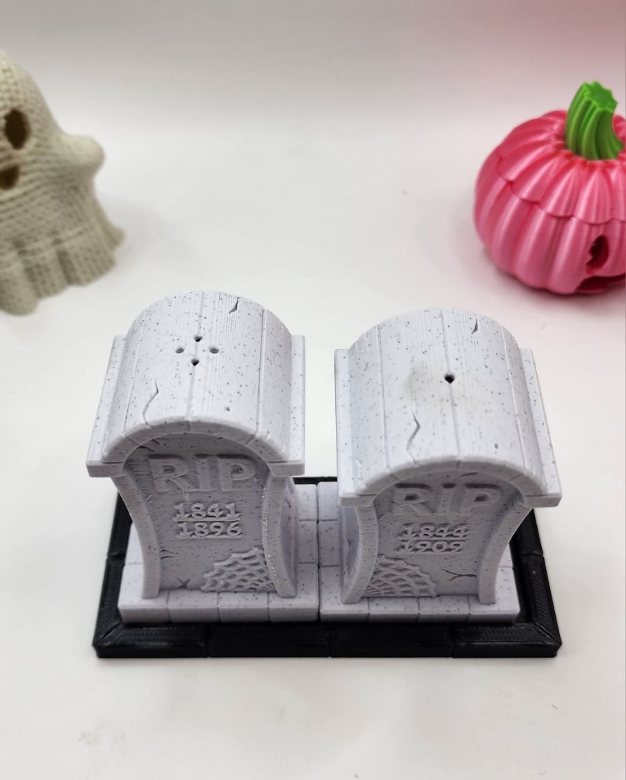 3D printed tombstone salt and pepper shakers.