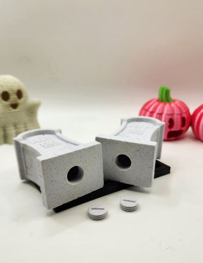 3D printed tombstone salt and pepper shakers.