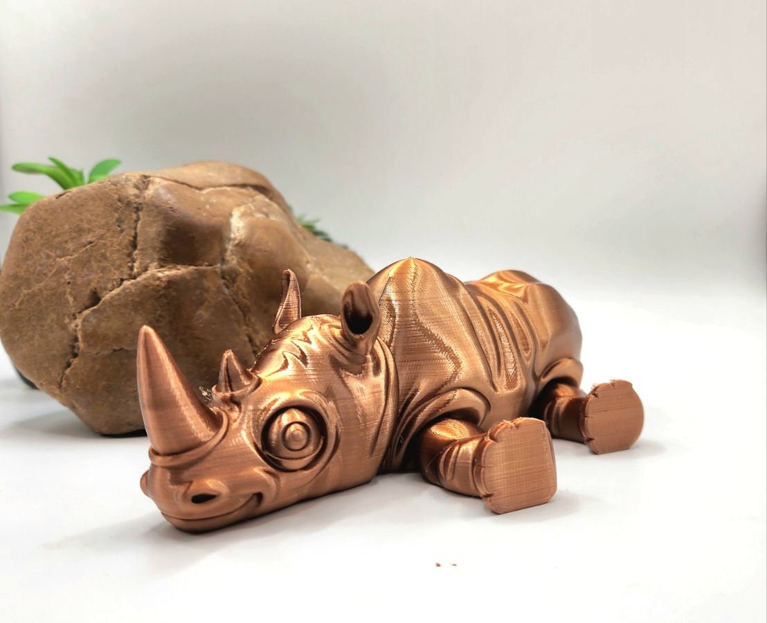 3D printed flexi rhino. Articulated, fidget toy.