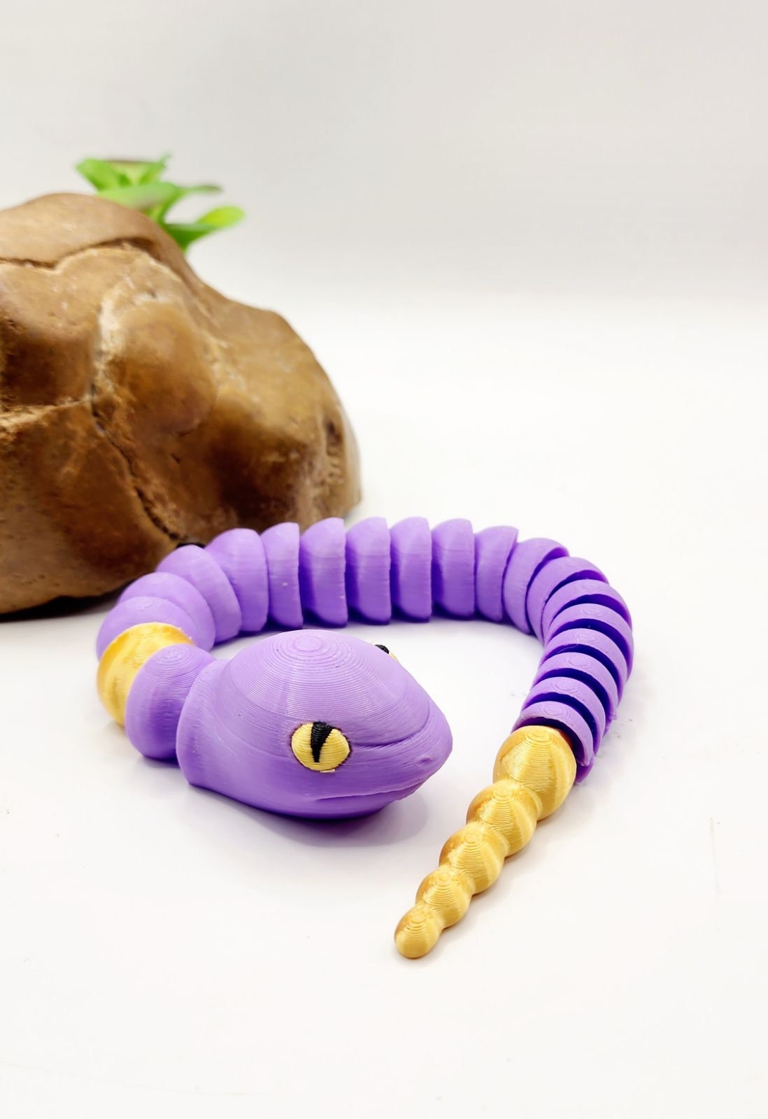 3D multicolor Pokemon Ekans articulated fidget sensory toy.