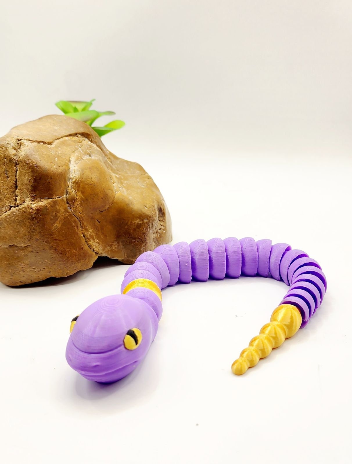 3D multicolor Pokemon Ekans articulated fidget sensory toy.