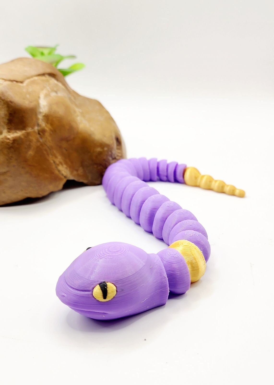 3D multicolor Pokemon Ekans articulated fidget sensory toy.