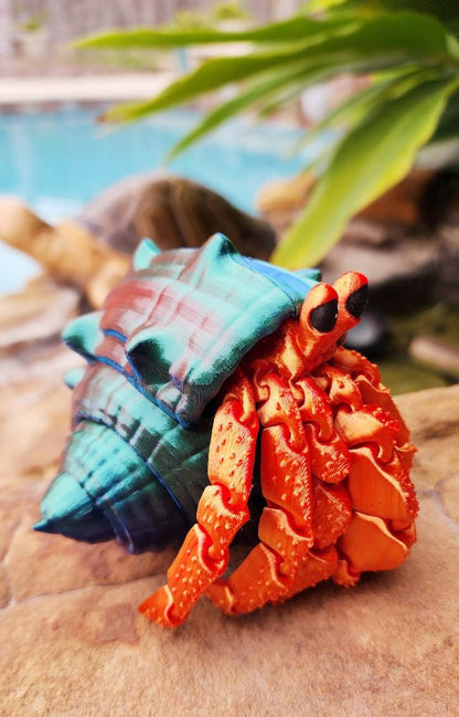 Articulated hermit crab with removable shell. Fidget toy, sensory toy.