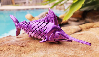 Articulated Marlin with its displaying plaque. Fidget toy, sensory toy.