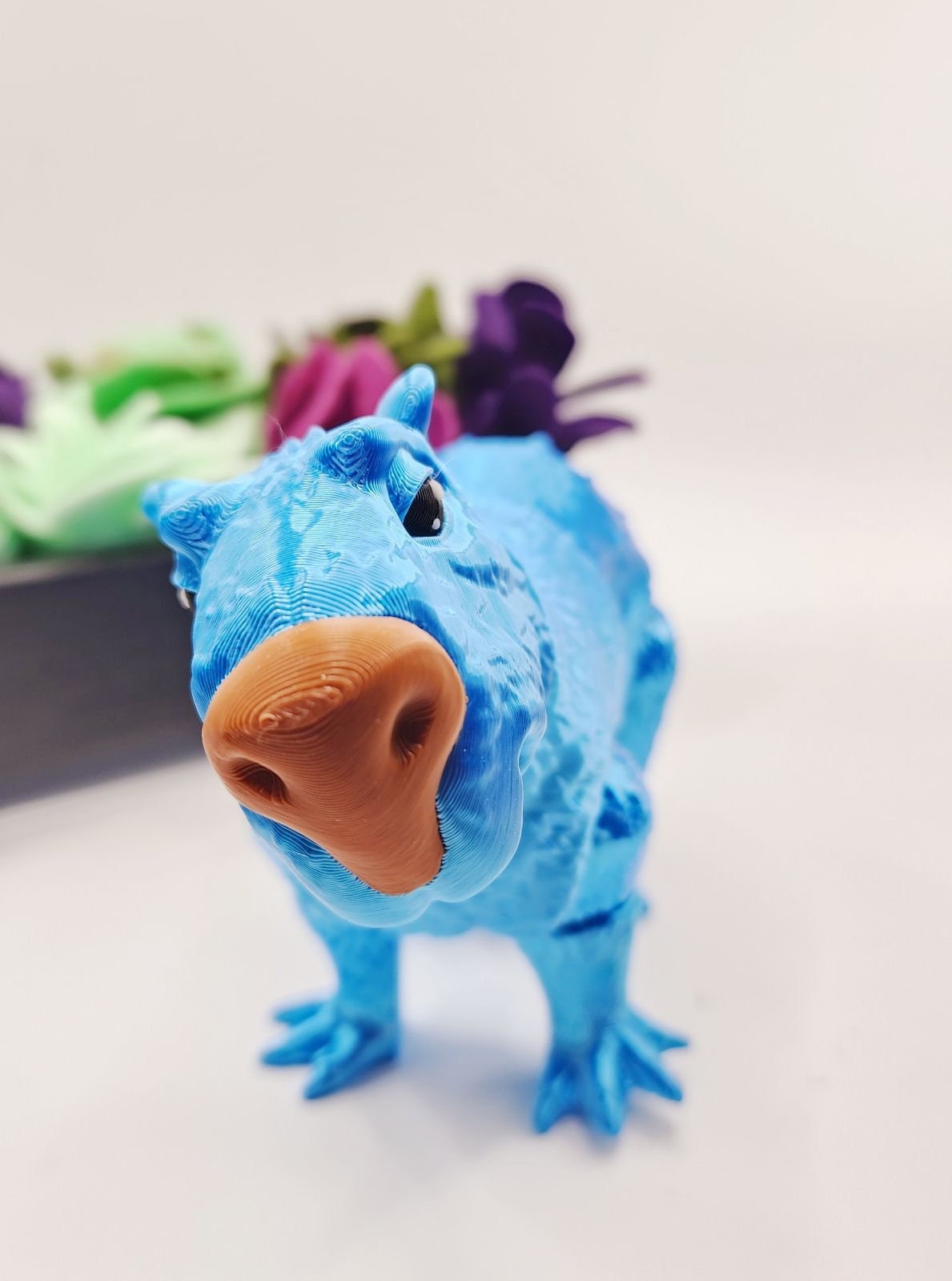 Capybara 3D multicolor printed articulate fidget toy.