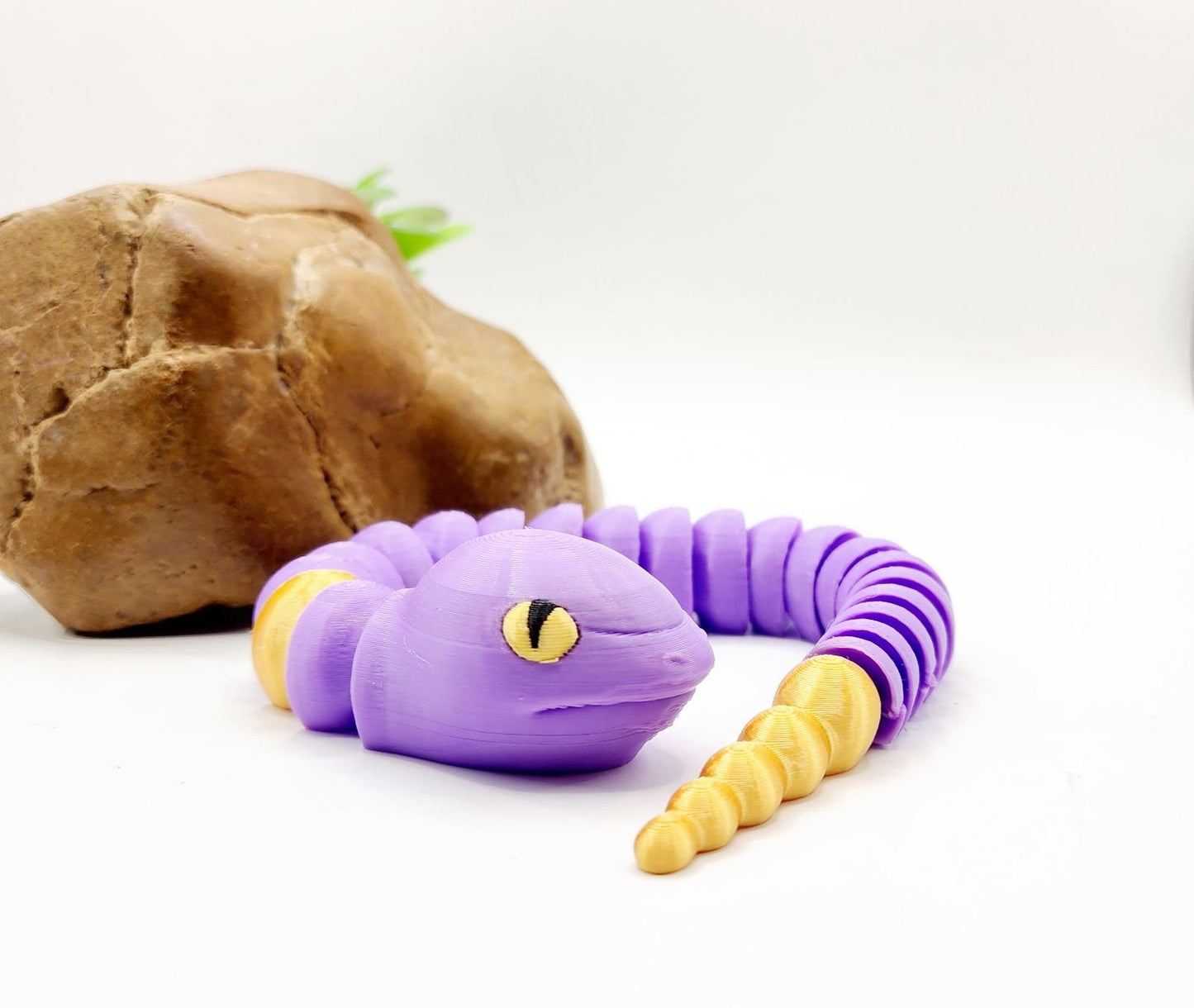 3D multicolor Pokemon Ekans articulated fidget sensory toy.