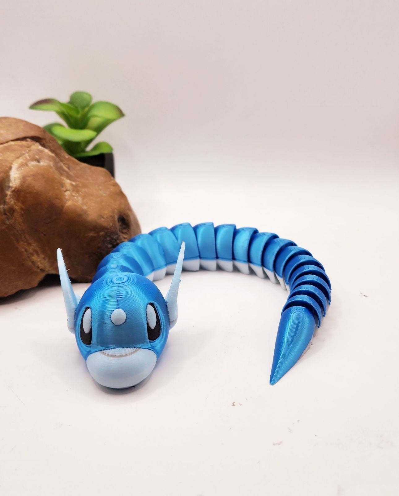 3D printed articulate pokemon dratini fidget toy.