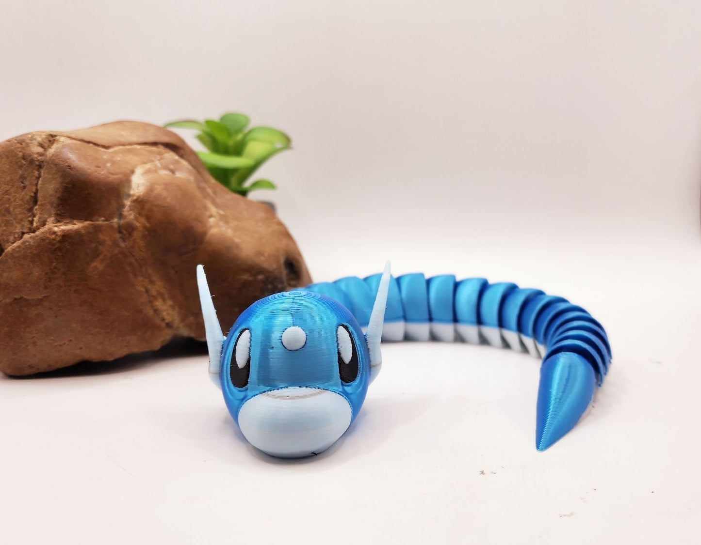 3D printed articulate pokemon dratini fidget toy.