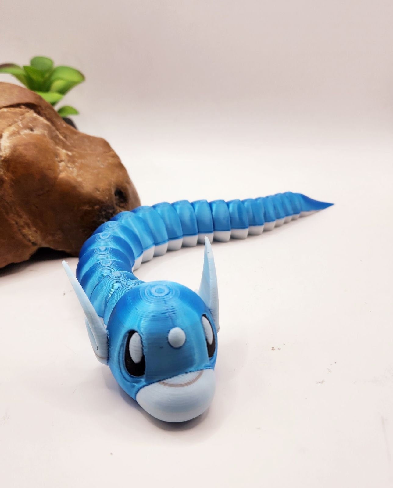 3D printed articulate pokemon dratini fidget toy.