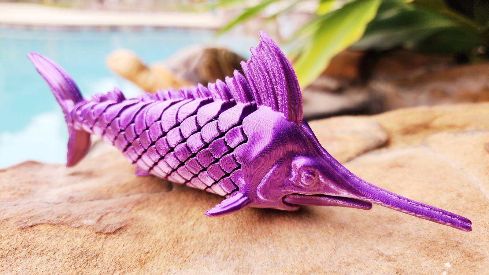 Articulated Marlin with its displaying plaque. Fidget toy, sensory toy.