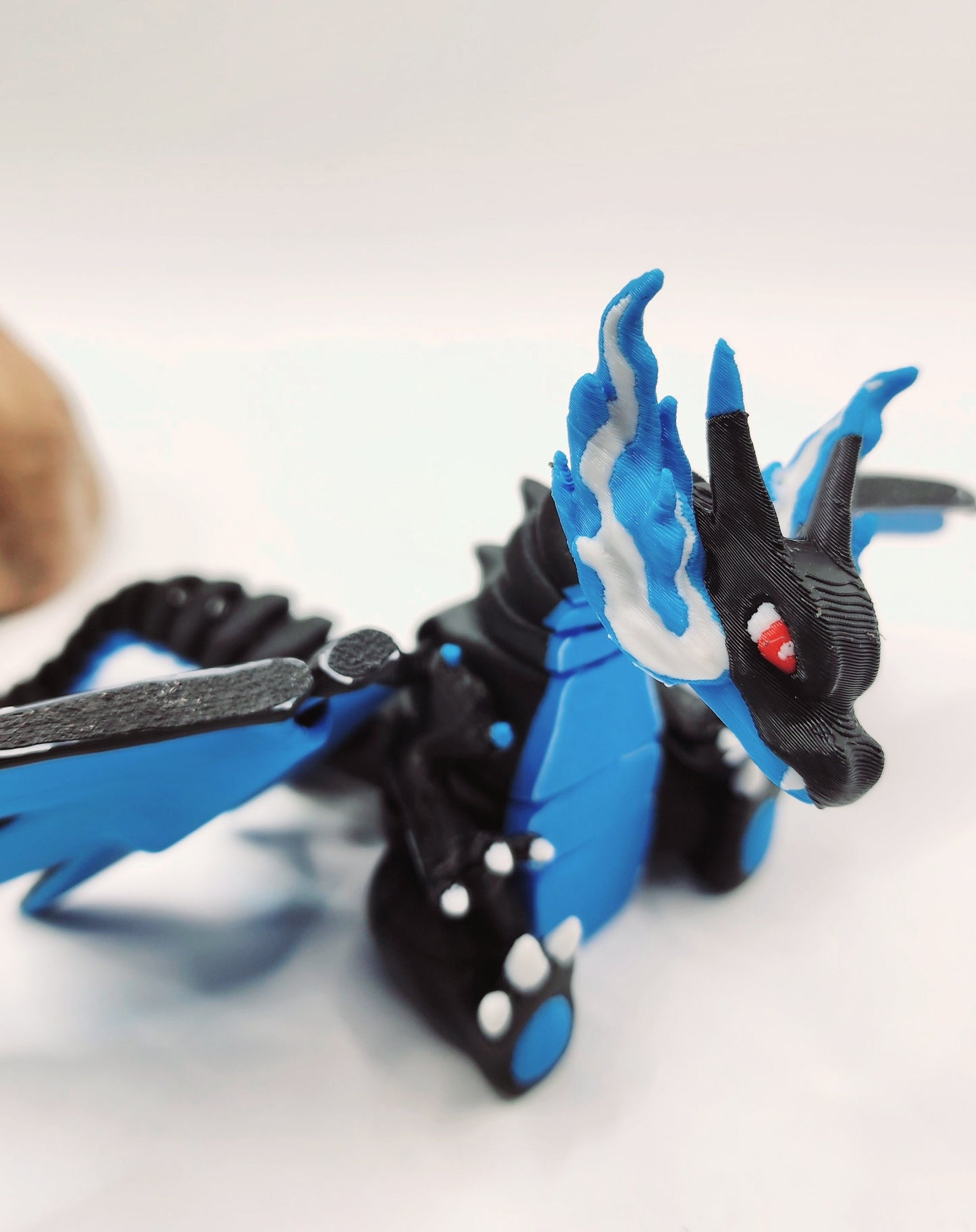 3D printed Mega Charizard X, articulated flexi fidget toy, sensory toy, desktop toy.