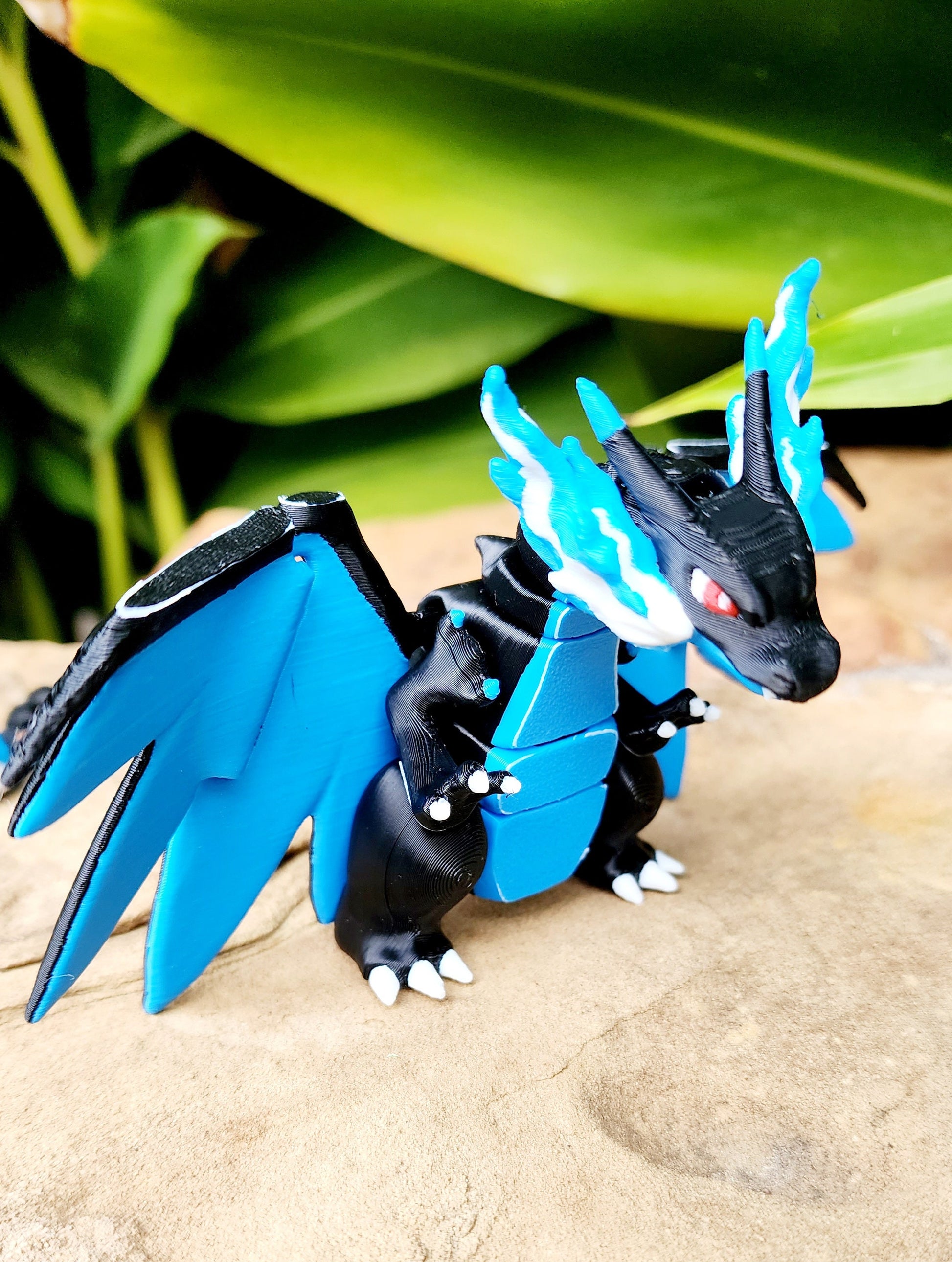 3D printed Mega Charizard X, articulated flexi fidget toy, sensory toy, desktop toy.