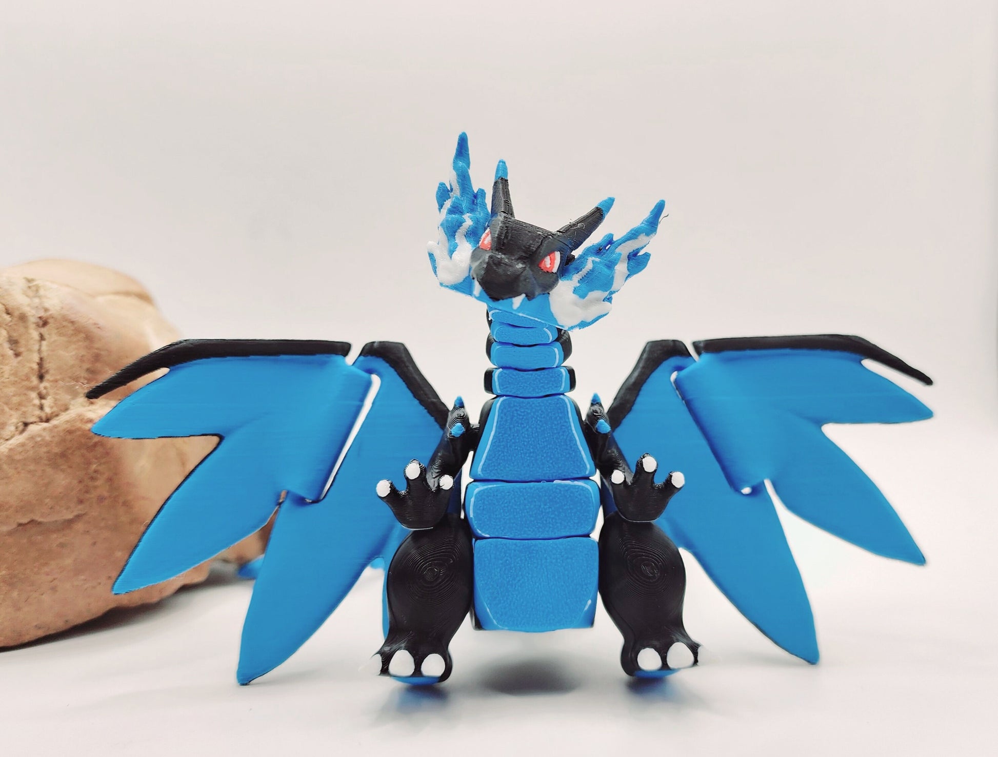 3D printed Mega Charizard X, articulated flexi fidget toy, sensory toy, desktop toy.