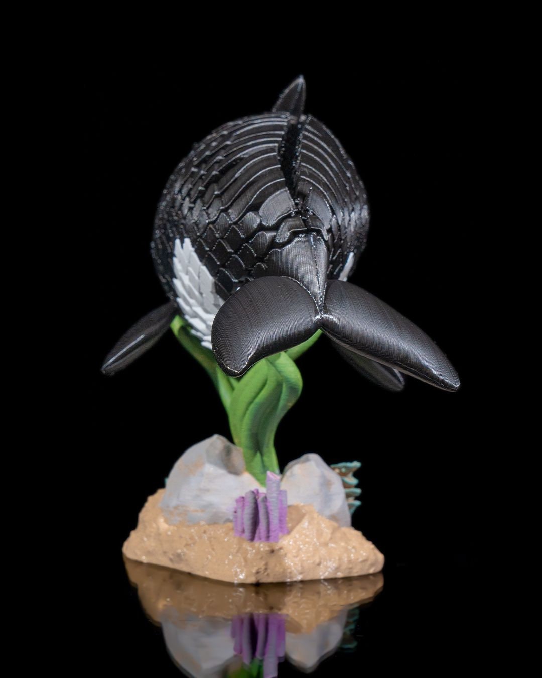 3D printed articulated Orca Whale fidget sensory toy.