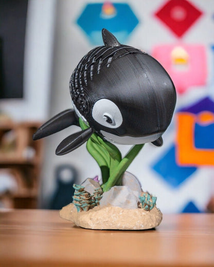 3D printed articulated Orca Whale fidget sensory toy.