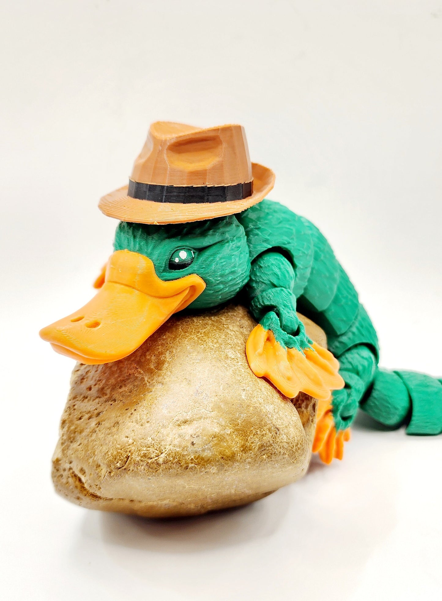 3D printed articulated Platypus fidget sensory toy. Desk Toy with a removable hat.