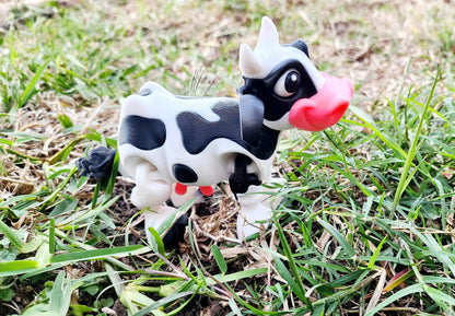 3D printed Milk cow articulated fidget toy. Sensory toy, desk toy.