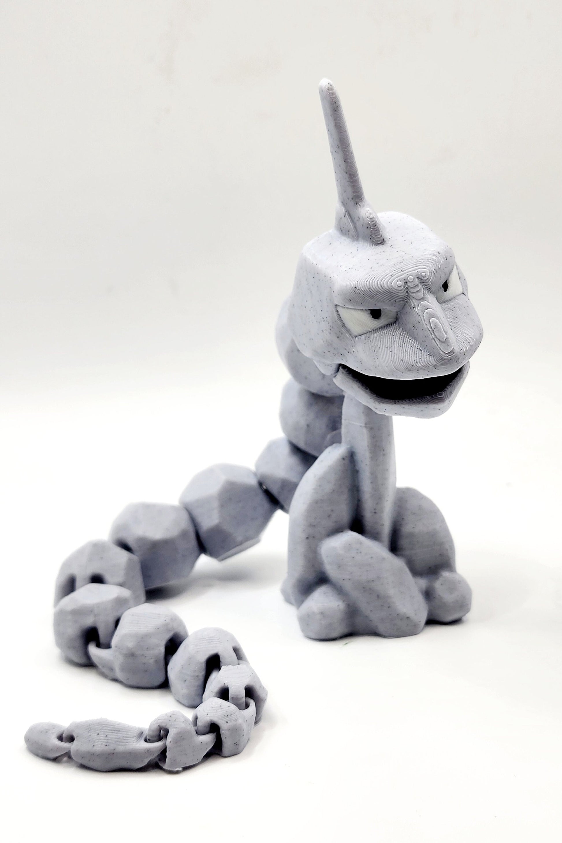 3D printed articulated Onix with articulated jaw. Fidget, Sensory toy.