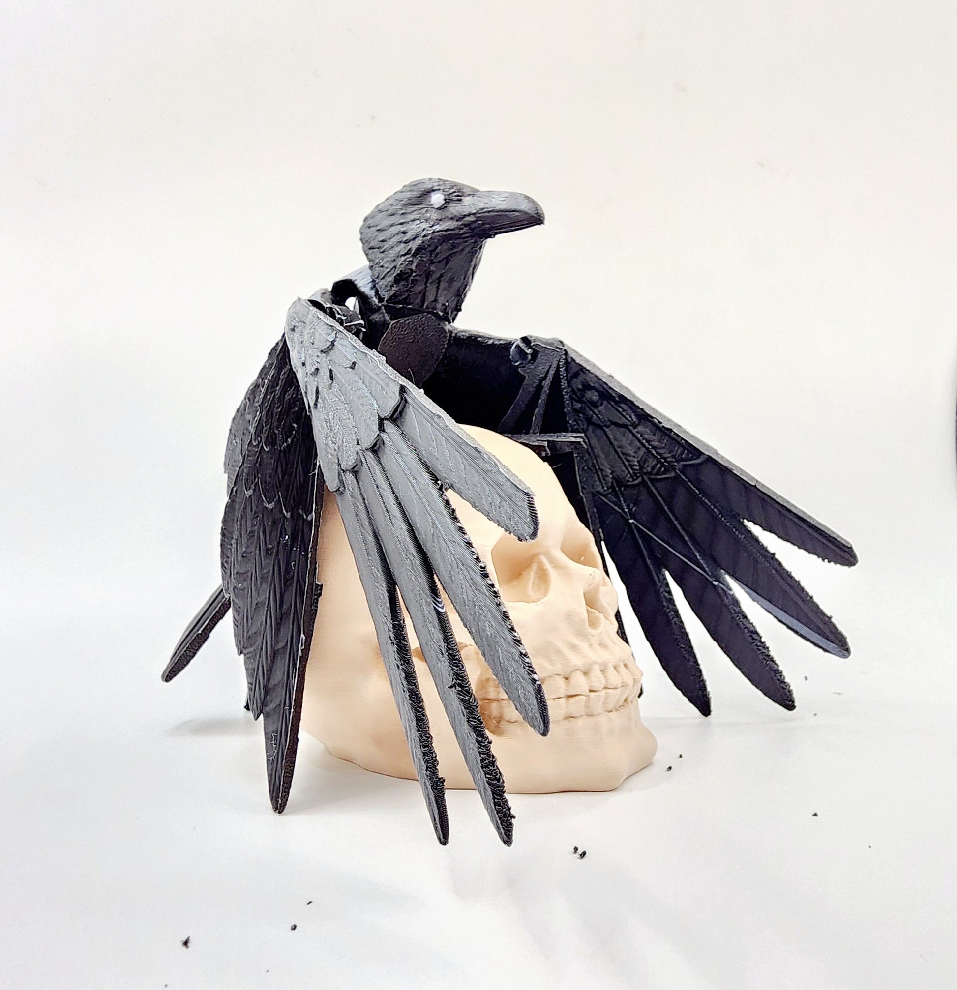 3D printed articulated Raven with articulated wings, fidget, sensory toy with optional skull base.