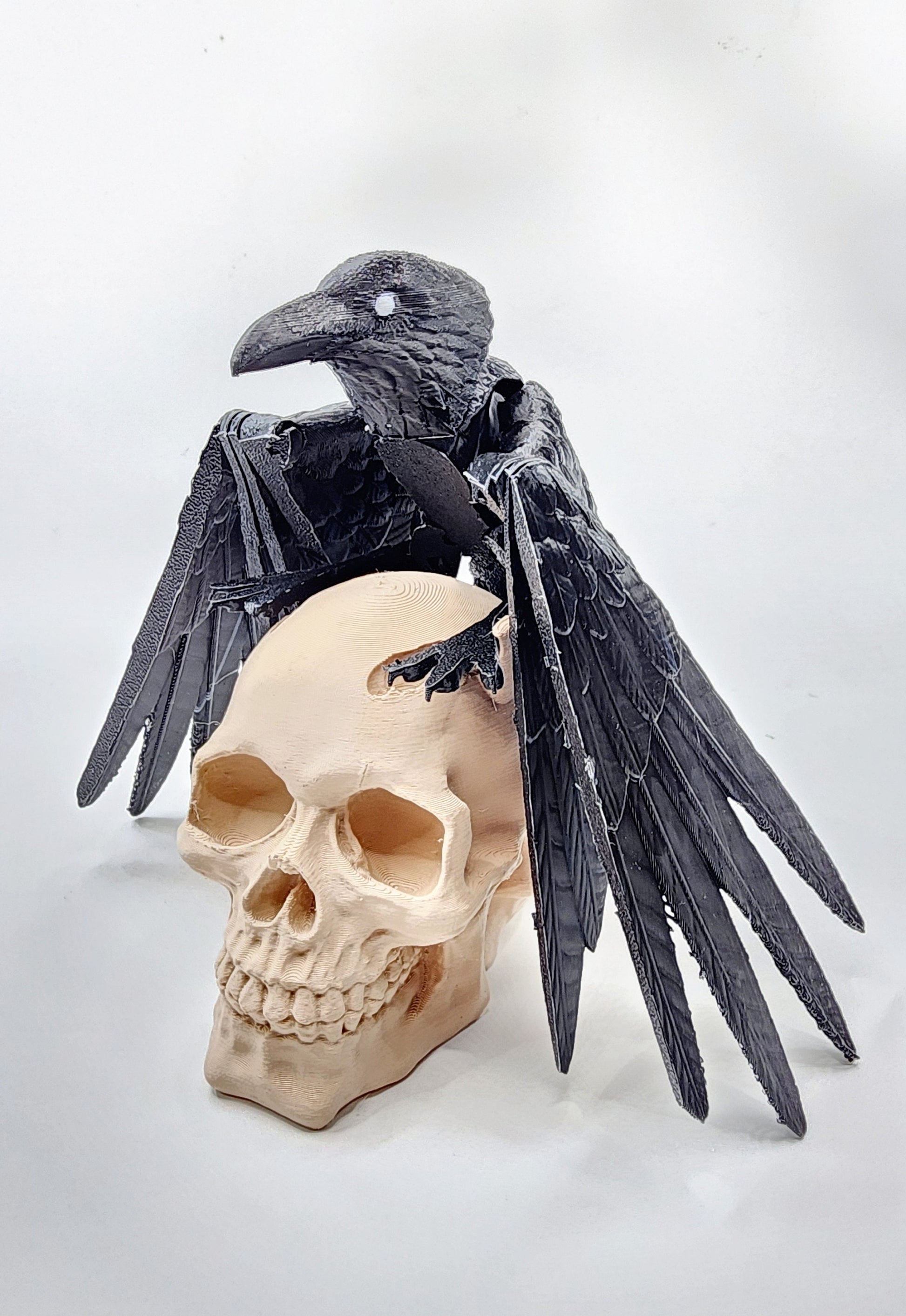 3D printed articulated Raven with articulated wings, fidget, sensory toy with optional skull base.