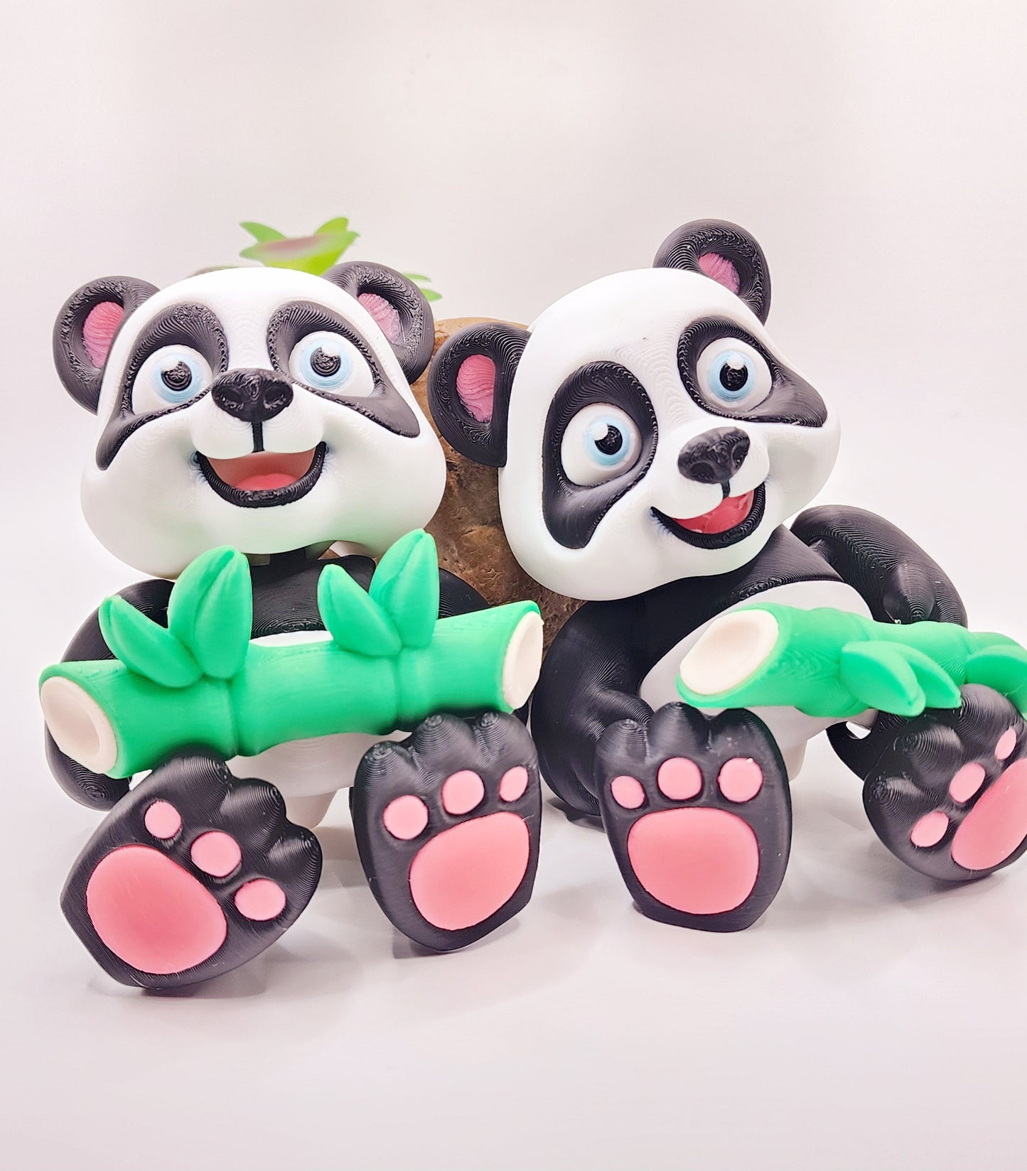 3D Printed articulated flexi baby Panda with bamboo fidget desk toy.