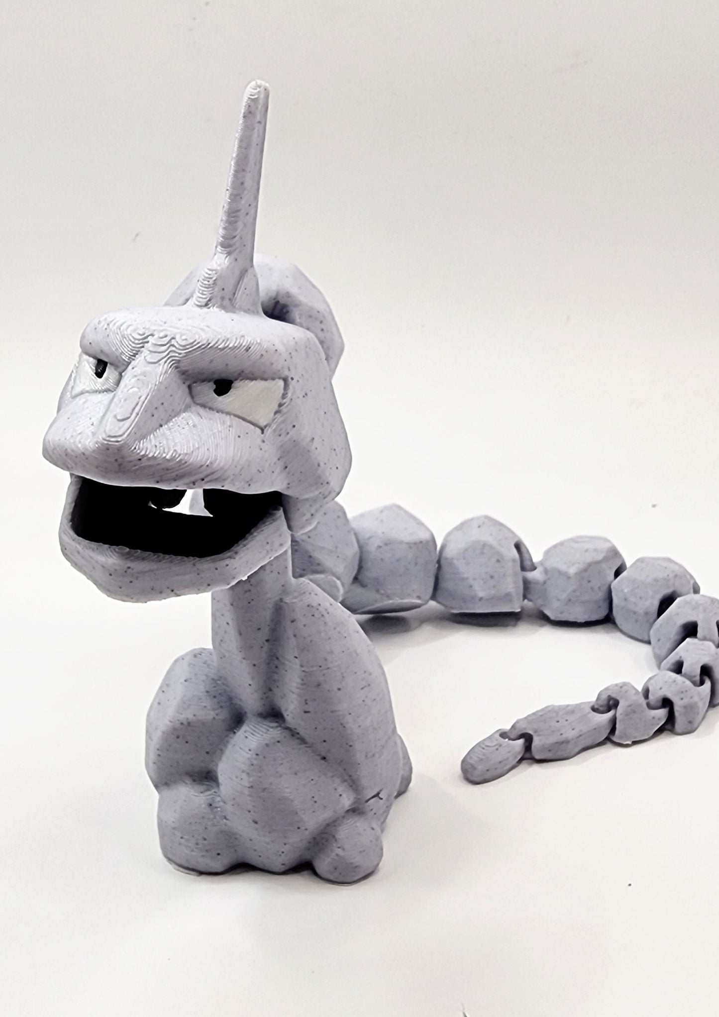 3D printed articulated Onix with articulated jaw. Fidget, Sensory toy.