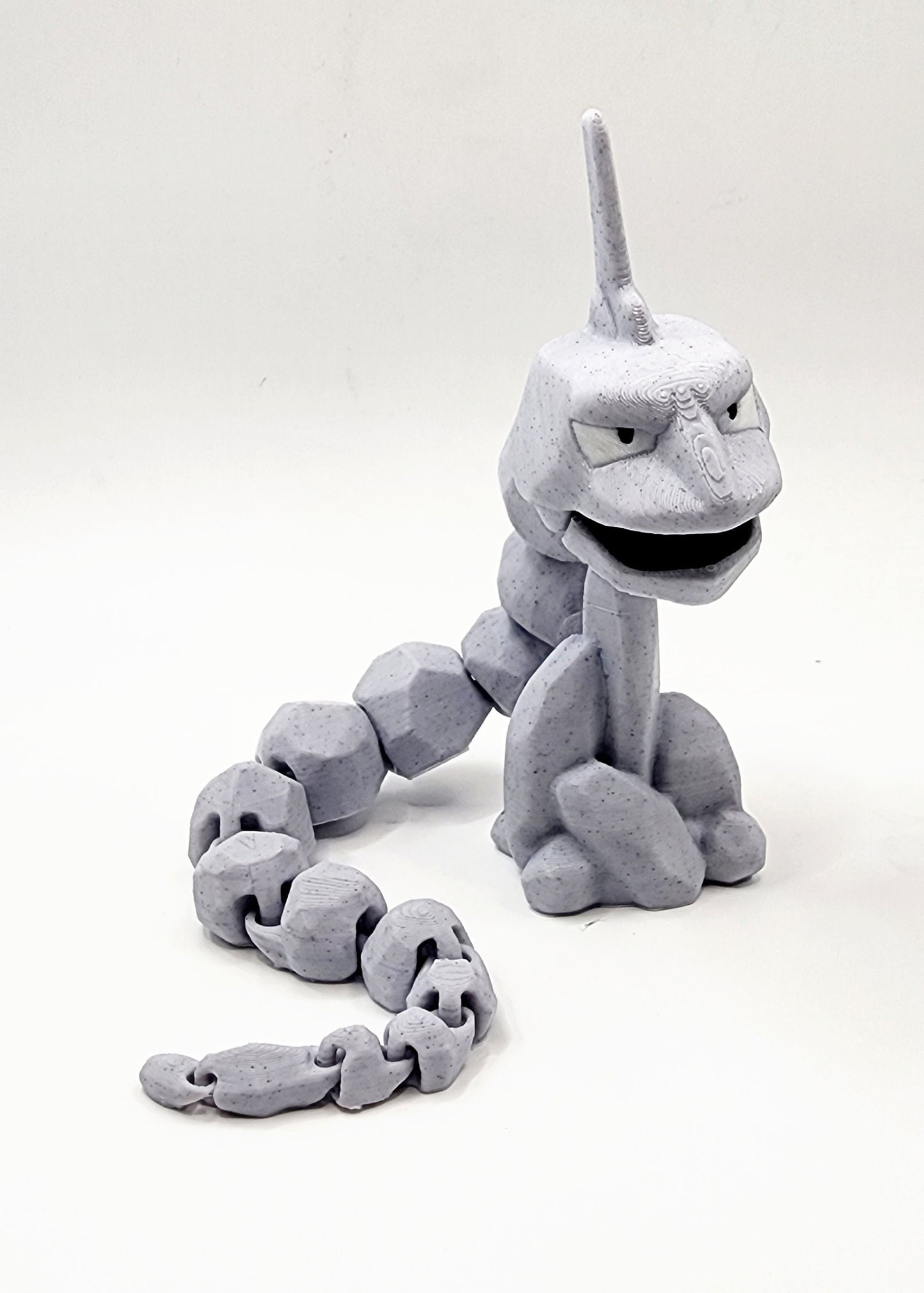 3D printed articulated Onix with articulated jaw. Fidget, Sensory toy.